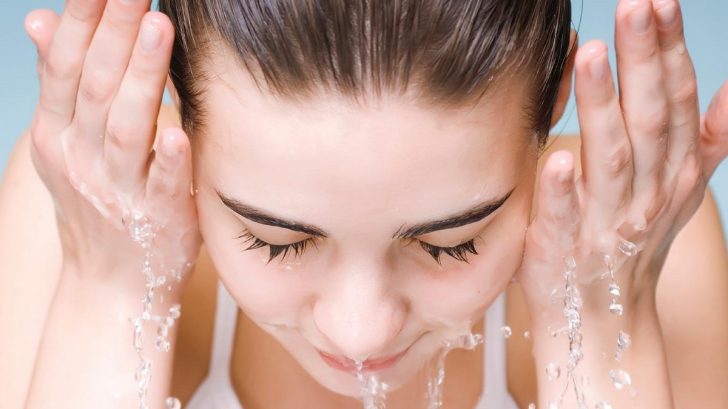 Woman washing face