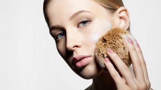 woman scrubbing her face